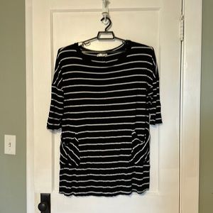 Black/White Striped,pocket details on front and button details on back. 22/24W.